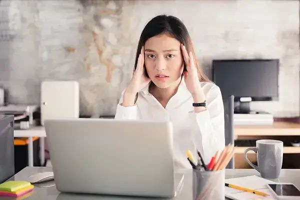 woman stressed sitting at desk