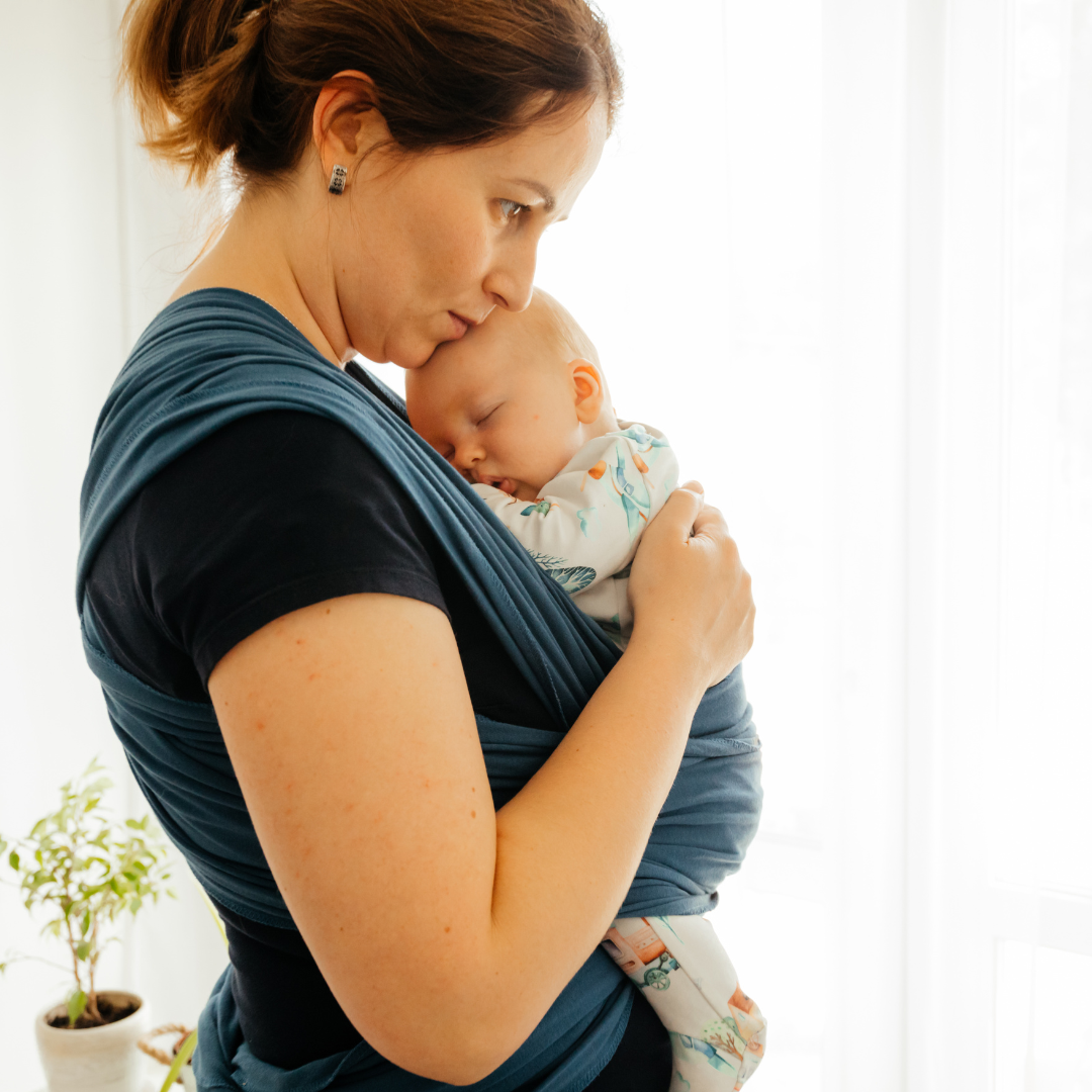 mom and baby son in carrier